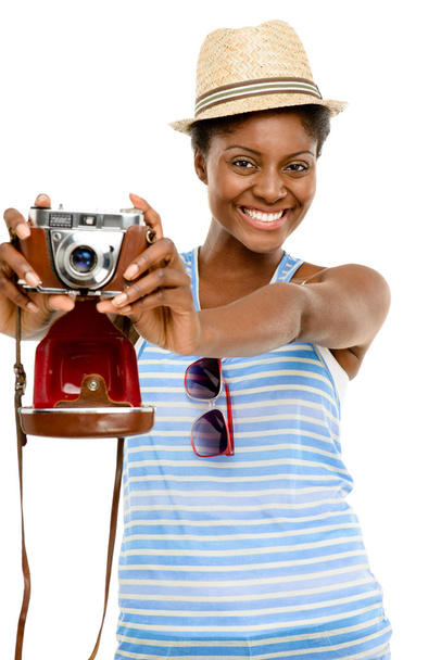 Happy African American woman tourist holding vintage camera isolated on white background - Фото, зображення