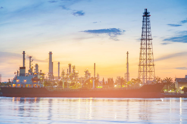 Oil refinery river front with sunset sky background  - Photo, Image
