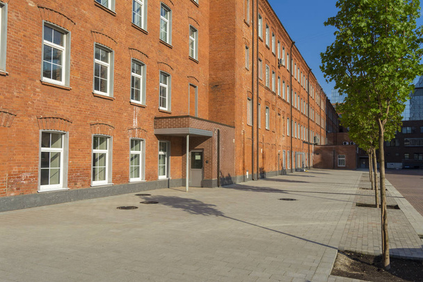 Office building of red brick in the yard of the old factory - Valokuva, kuva