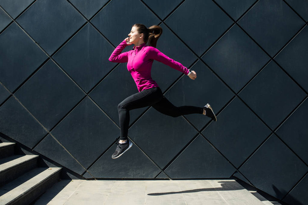 Fitness sport girl in sportswear doing yoga fitness exercise in the street, outdoor sports, urban style - Φωτογραφία, εικόνα