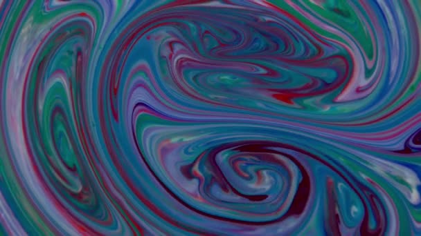 This stock video features the slow motion footage of multi-color paints rotating in layered swirls. Some of the colors merge and combine into new shades. Use this clip as abstract background for assorted advertisements, information videos, announceme - Footage, Video