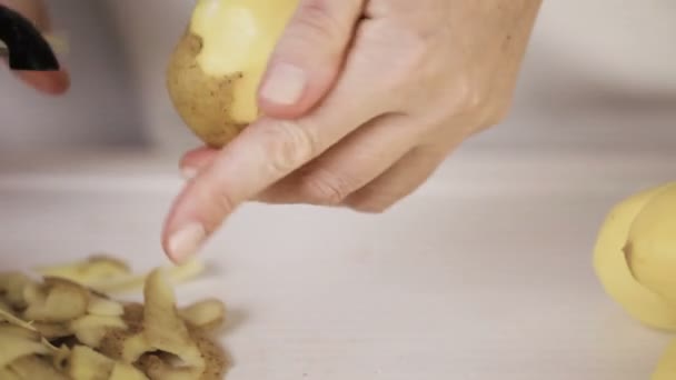 Step by step. Peeling Yukon gold potatoes for classic mashed potatoes - Footage, Video