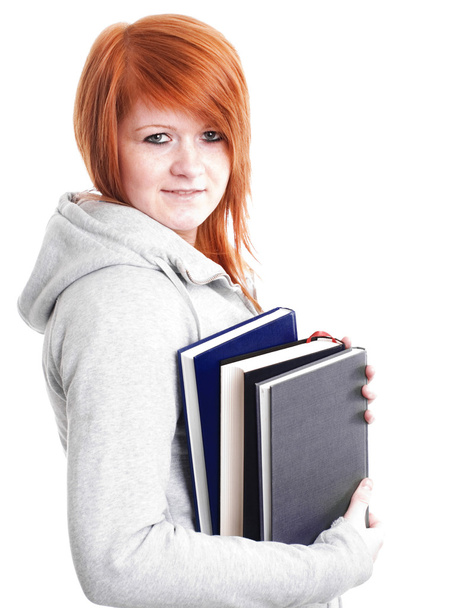 Teenager holding book over white - Foto, afbeelding