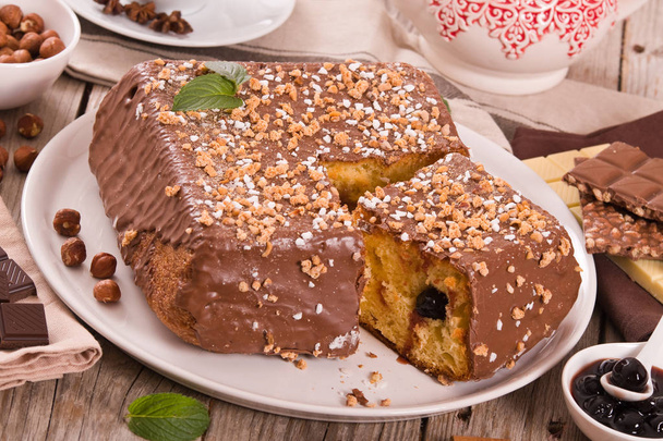 Chocolate hazelnut cake on white dish. - Photo, image