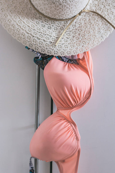 Women's swimsuit with straw hat. - Φωτογραφία, εικόνα