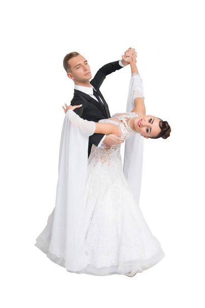 dance ballroom couple in colorful dress dance pose isolated on white background. sensual professional dancers dancing walz, tango, slowfox and quickstep. - Zdjęcie, obraz