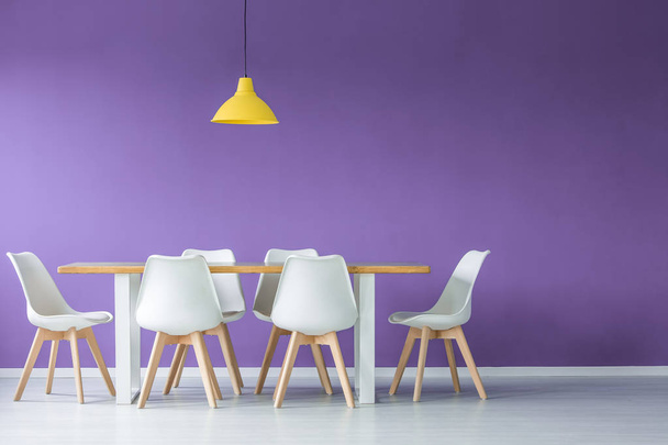 Chairs against purple wall - Foto, imagen