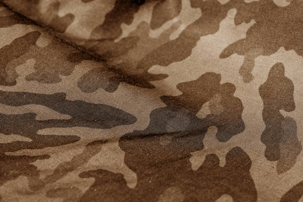 Militaire uniform patroon met blur effect in bruine Toon. - Foto, afbeelding