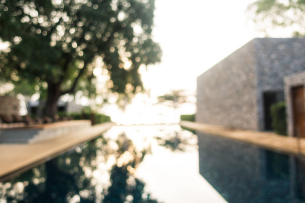 Abstract blur defocused swimming pool in luxury hotel resort - Foto, afbeelding