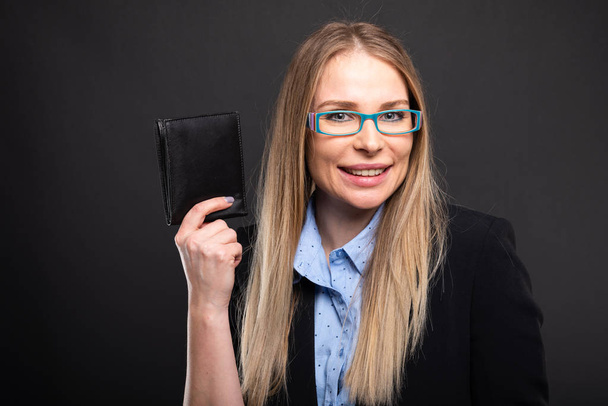 Business lady wearing blue glasses holding walle - Photo, Image