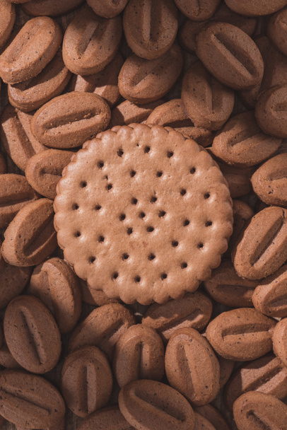 top view of delicious cookies in shape of coffee beans and round cookie - Photo, Image