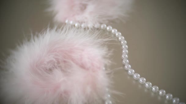 Fur handcuffs. beautiful exquisite sex toys for adults on a table near the mirror in the bedroom. 4k, slow-motion, close-up - Metraje, vídeo