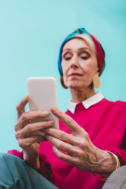 selective focus of senior woman using smartphone - Photo, image