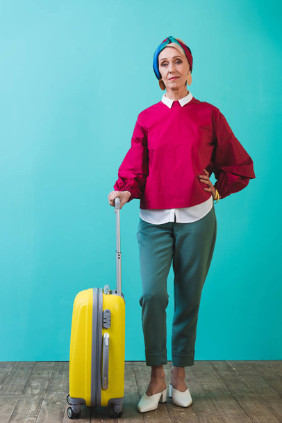 female senior tourist with travel bag - 写真・画像