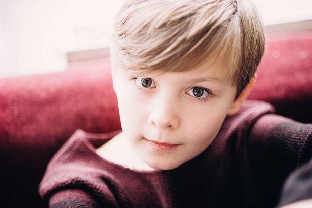 a closeup portrait of a cute kid boy with grey eyes - Photo, image