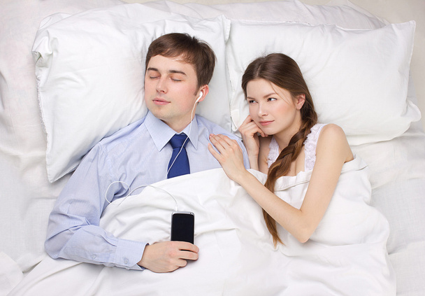 businessman and woman in bed - 写真・画像
