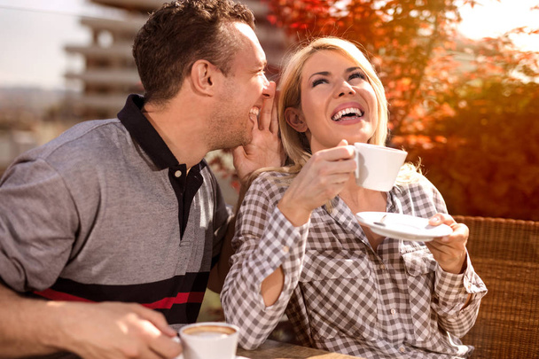 happy couple enjoying a coffee at the coffee shop - Фото, изображение