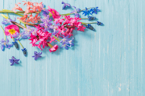 spring flowers on old blue wooden background - Fotoğraf, Görsel