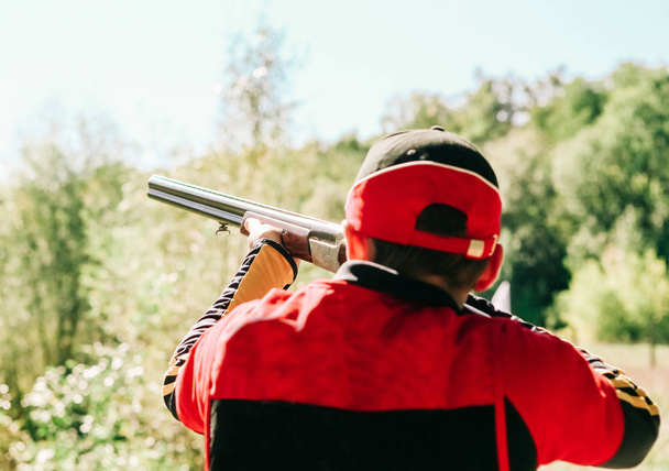 hunter is aiming shot shotgun forest - Foto, immagini