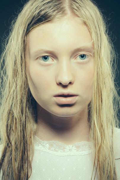 Sensual blond young woman with wet hair look at camera - 写真・画像