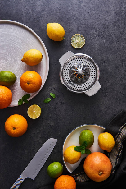 Juice preparation. Fresh ripe citruses on dark background. - Valokuva, kuva