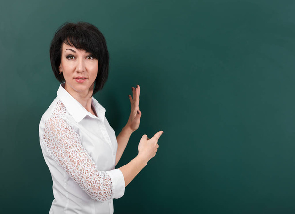 woman posing and expressing various emotions on school Board background, learning concept, Studio shot - Foto, Imagen