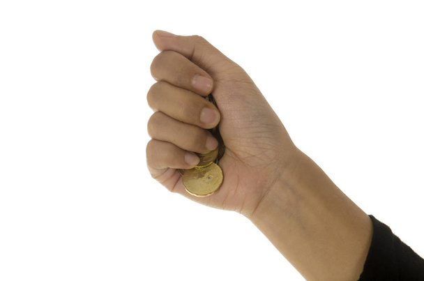 een vrouwelijke hand met munt geïsoleerd tegen een witte achtergrond - Foto, afbeelding