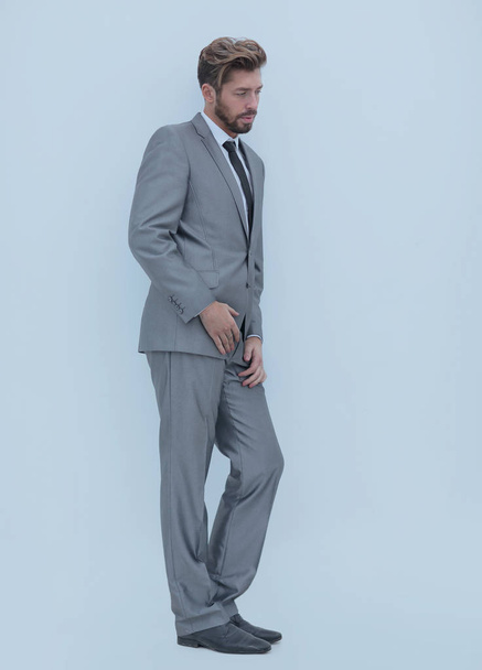 side view of an arrogant stylish man in suit - Foto, Bild