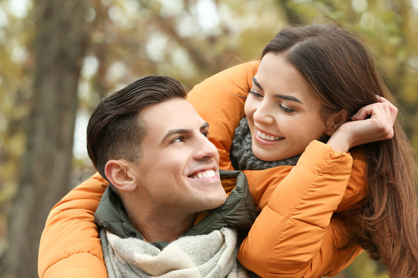 Beautiful couple in warm clothes outdoors - Photo, Image