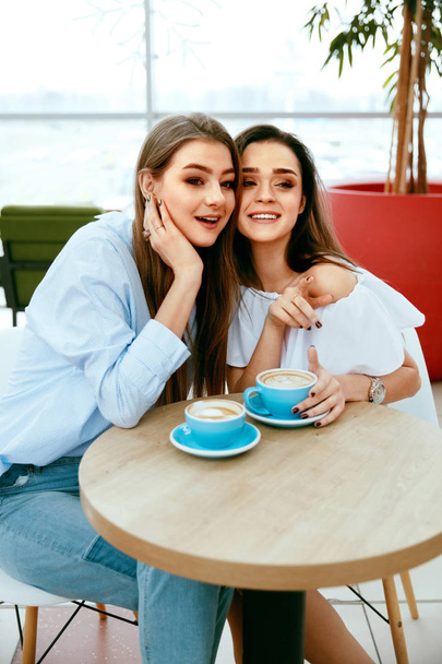 Girls Friends Drinking Coffee In Cafe - Фото, изображение