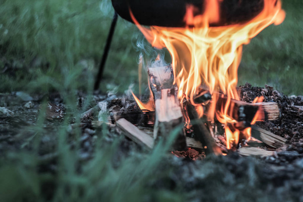 Preparing food on campfire in wild camping, close-up photo - Foto, Imagen