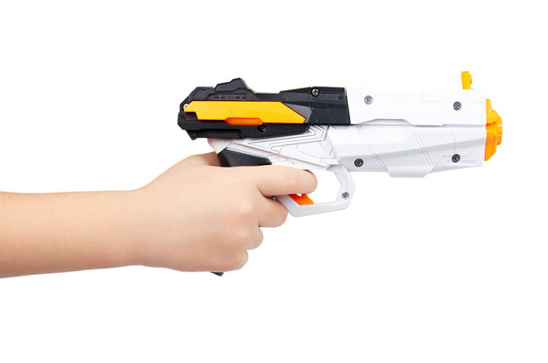 Futuristic toy gun with kid hand, isolated on white background - Foto, Imagen