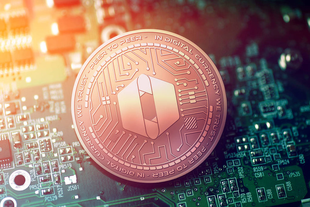shiny copper SOLA cryptocurrency coin on blurry motherboard background - Photo, Image