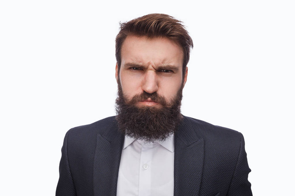 Grumpy bearded man in suit on white - Фото, зображення