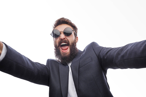Crazy cheerful man in suit and sunglasses - Foto, imagen