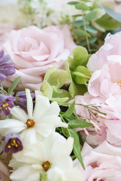 Wedding bouquet of jasmine, roses, peony and buttercup. Lots of greenery, modern asymmetrical disheveled bridal bunch. Spring flowers - Φωτογραφία, εικόνα