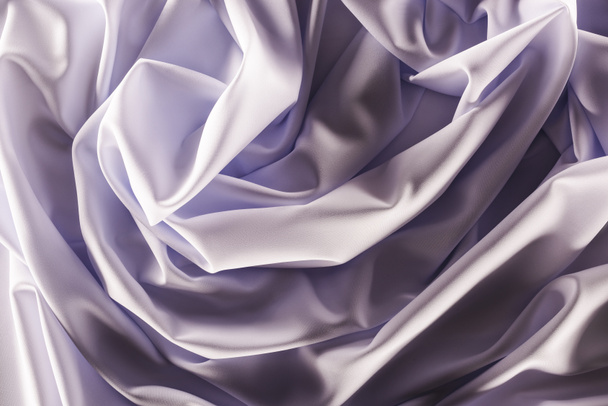 full frame of folded elegant purple silk fabric as background - Фото, зображення