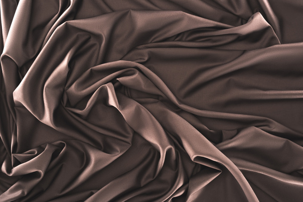 full frame of folded dark silk cloth as background - Zdjęcie, obraz