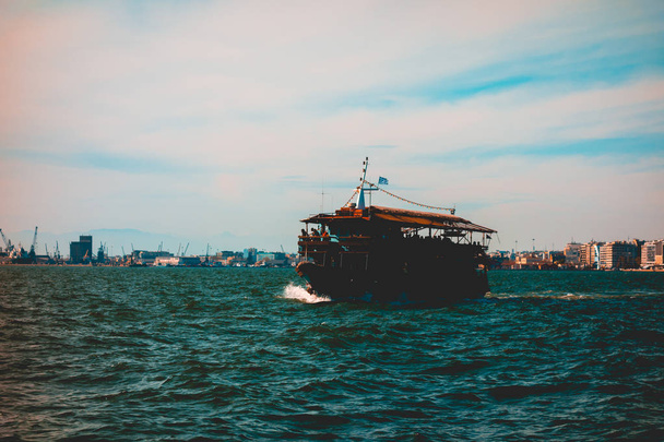 vintage colored picture of touristic boat on the sea - Photo, Image