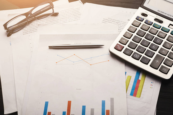 Calculator and business charts with credit system - Fotoğraf, Görsel