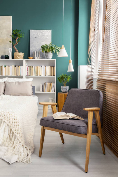 Gray armchair in bedroom - Фото, зображення