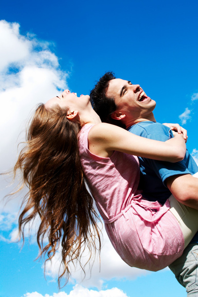 Happy Young couple against the sky - Zdjęcie, obraz