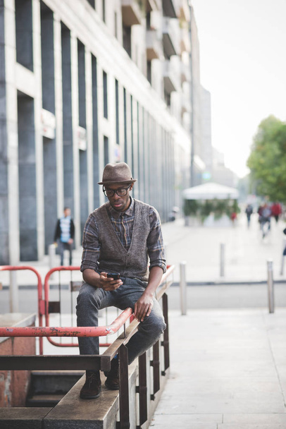 young handsome african man using smartphone in the city - Foto, immagini