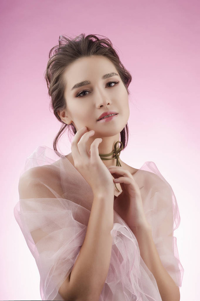 Beautiful charming young big breast asian girl wearing a pink ve - Foto, Bild