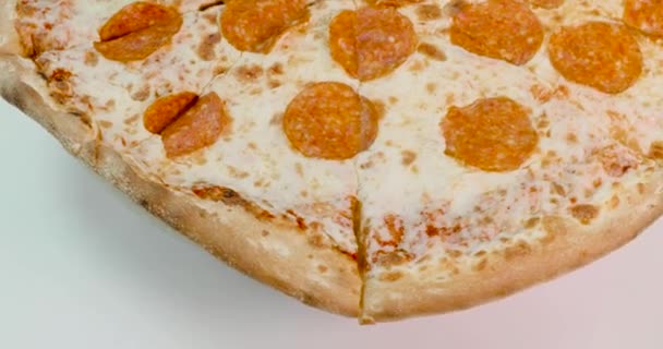 pepperoni pizza revolves around its axis - Filmati, video