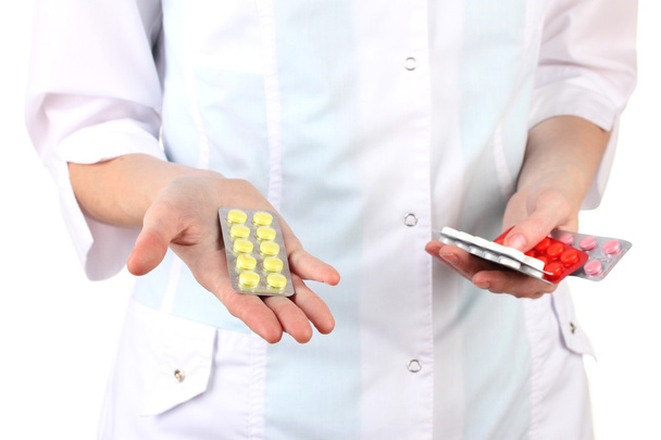 Close-up of female doctor hand holding pills, isolated on white - Valokuva, kuva
