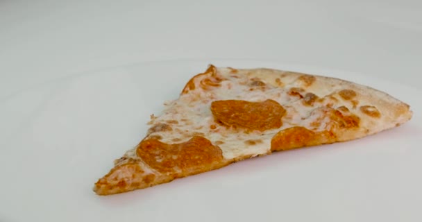 piece of pizza spins around its axis - Video