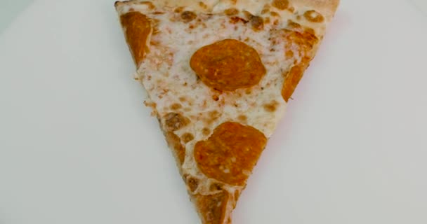 piece of pizza spins around its axis - Video