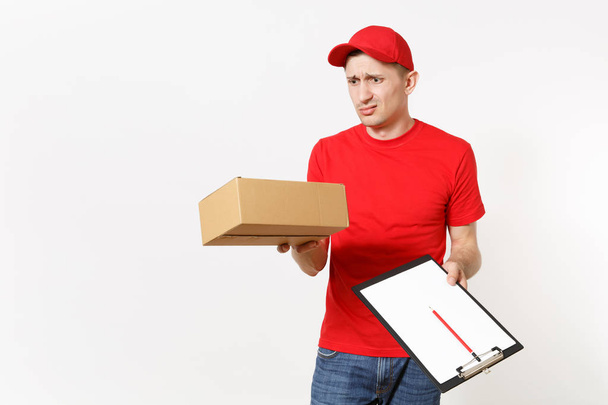 Delivery man in red uniform isolated on white background. Male courier in cap, t-shirt holding pen, clipboard with papers document, blank empty sheet, cardboard box. Receiving package. Copy space. - Photo, Image