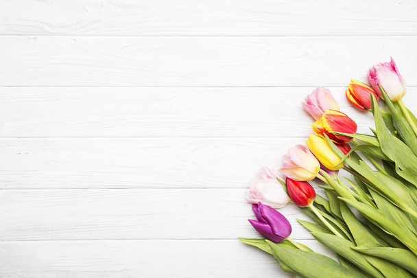 colorful tulips on white wooden background. - Photo, Image